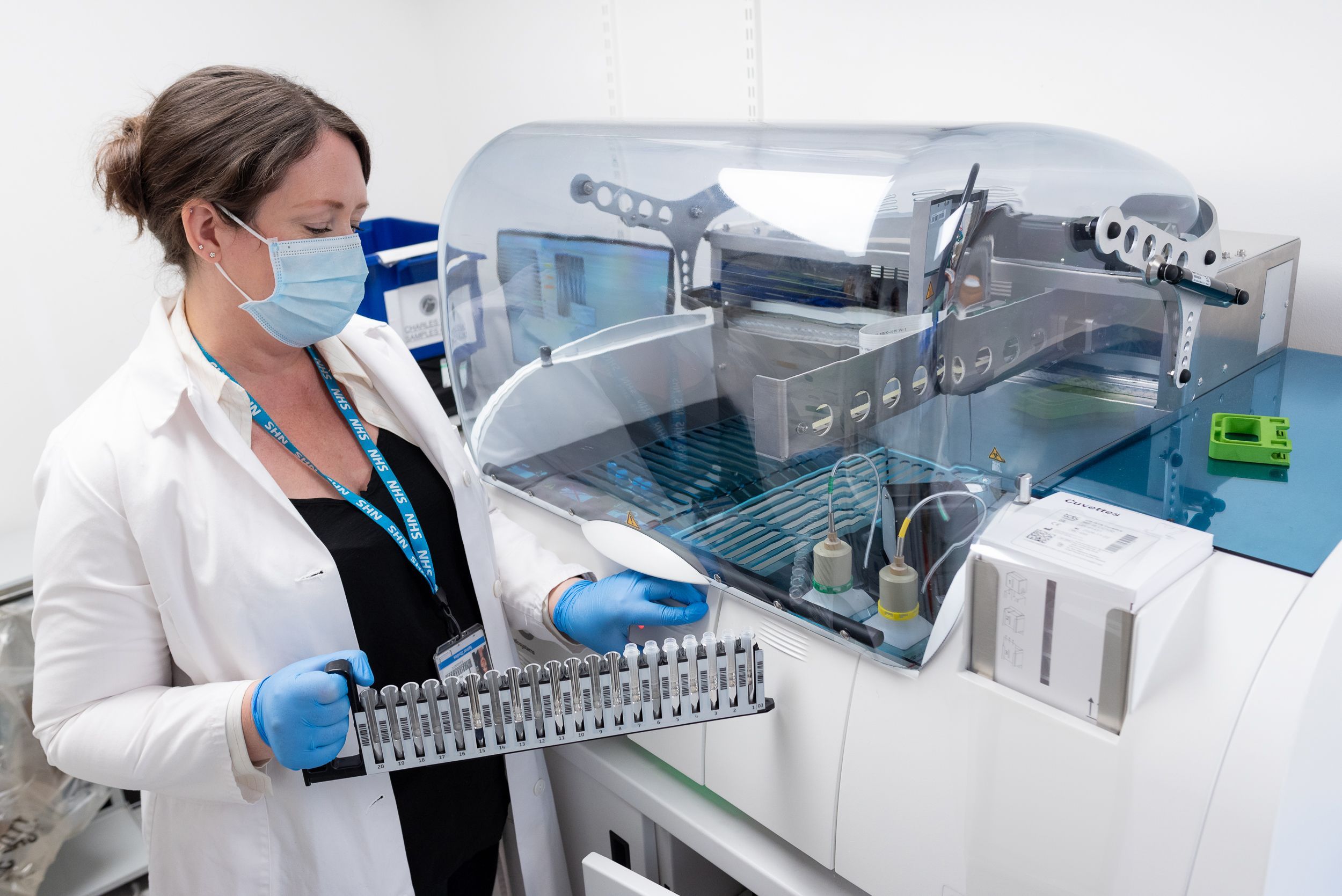 A staff member using lab equipment